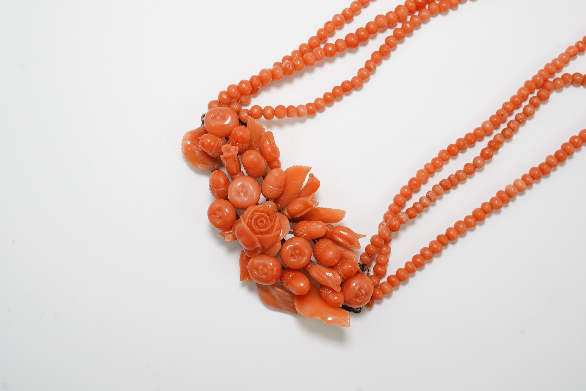 A late Victorian triple strand coral bead necklace